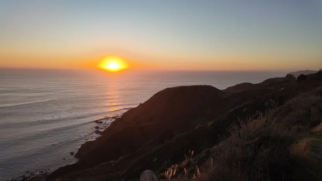 Sun setting over the horizon in Big Sur